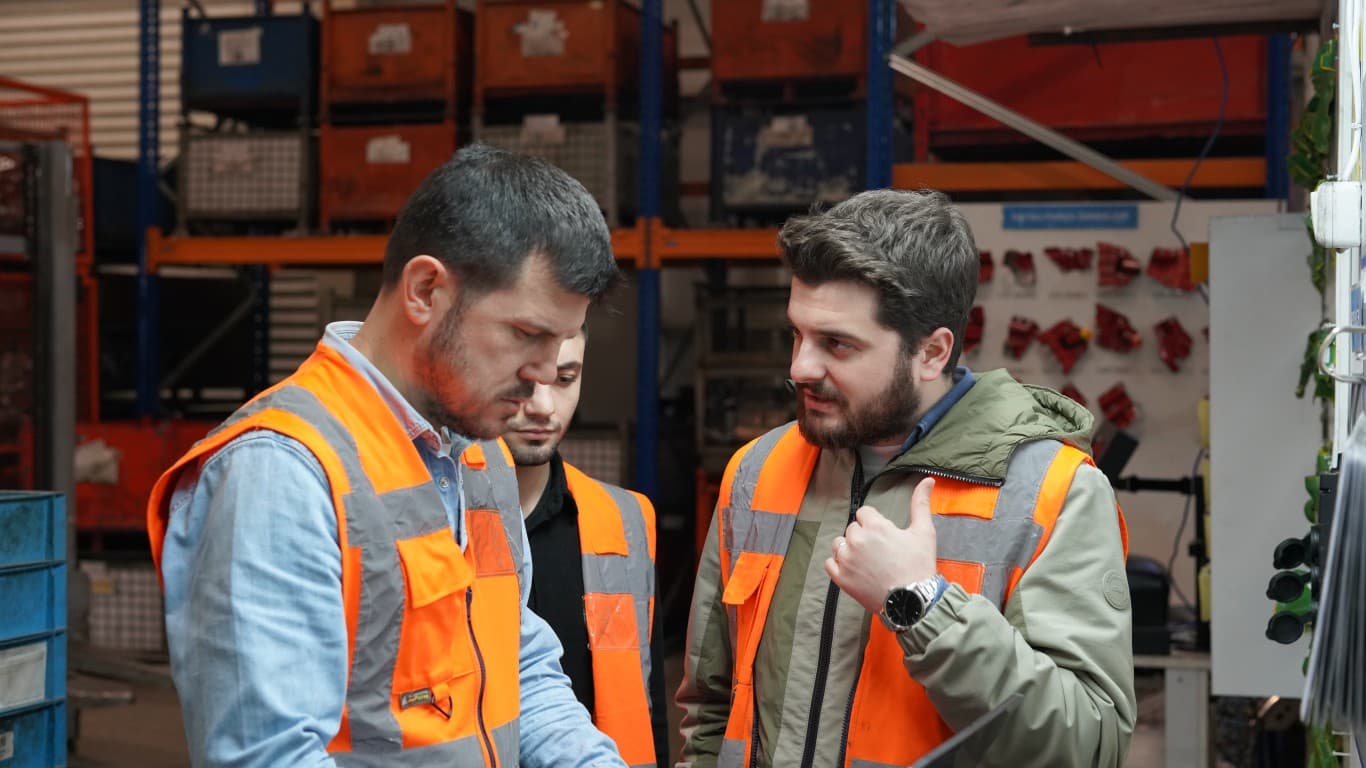 Codlean team members reviewing work on the factory floor