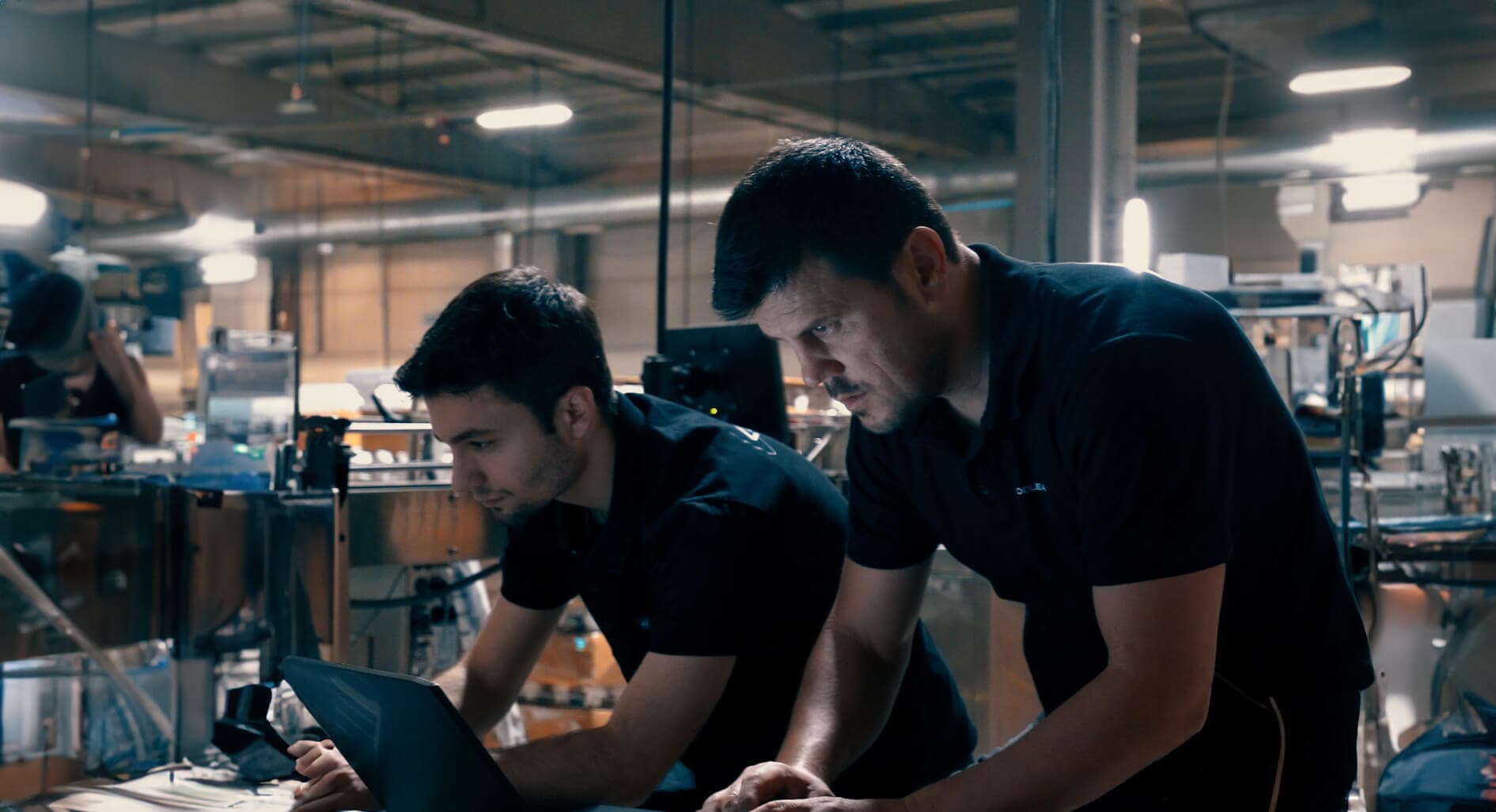 The Codlean team working on a digital system on the factory floor